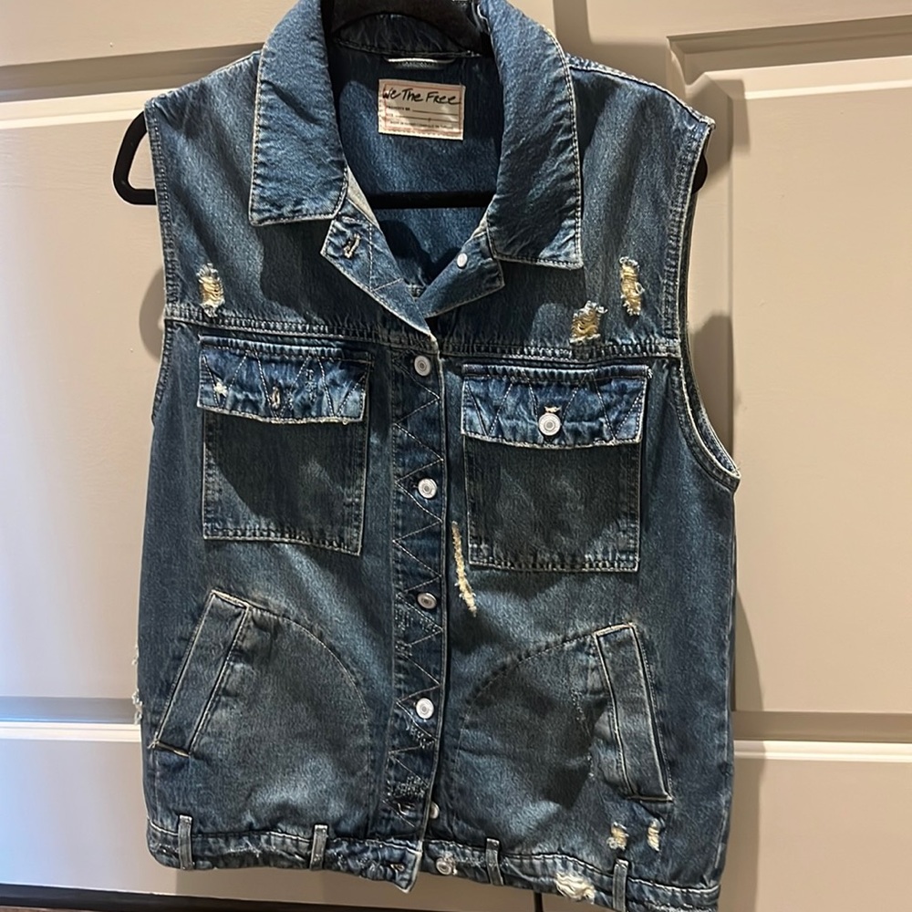 Distressed denim vest